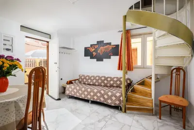 a living room with a couch and a bunk bed at Matzi House in Chania Town