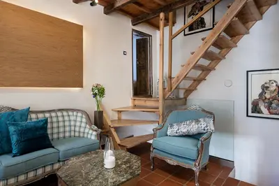 a living room with a couch and a chair at Agazade Bey in Chania Town