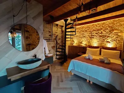a bedroom with a bed with a mirror and a sink at INO II Domus POOL by Amigdalokefali Elafonissi in AmigdhalokeFálion