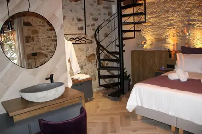 a bathroom with a sink and a bed and a mirror at INO II Domus POOL by Amigdalokefali Elafonissi in AmigdhalokeFálion