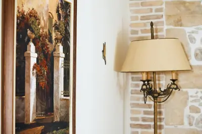 a lamp sitting next to a painting on a wall at Ekavi Apartment in Kissamos