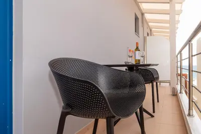 a dining room with a table and chairs at Libyan Sunrise in Palaiochóra