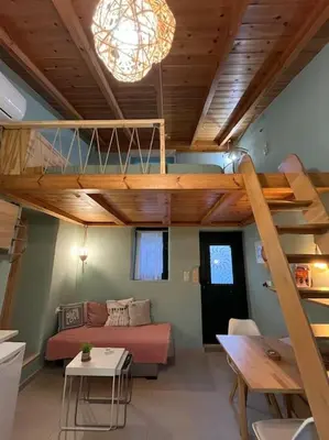 a living room with a loft bed and a couch at Maria`s Peaceful Nest in Chania Town