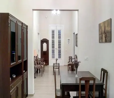 a dining room with a table and chairs at Kissamos Grandfather's House in Kissamos