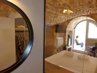 a room with a mirror and a room with a table at Eva Plus in Chania Town