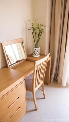 a desk with a laptop and a potted plant on it at Alexandra SeaSide Villas in Plataniás
