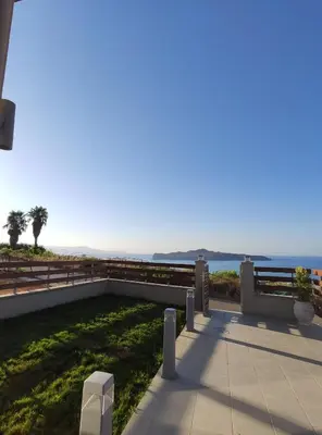 a patio with a view of the ocean at Wish Sea & Mountain View in Stalos