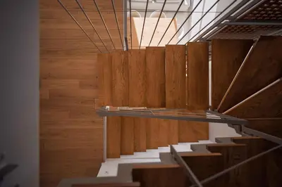 a staircase in a room with wooden walls and wood floors at Omnia Villas - 