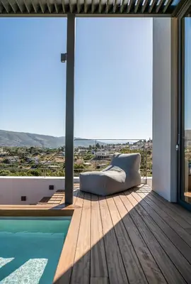 a view from the balcony of a house with a couch at Seametry Luxury Living Penthouse in Souda