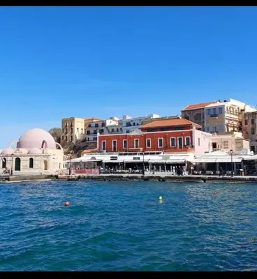a large body of water with buildings in the background at Apolafsi Apartments 1New with kitchen in Chania Town