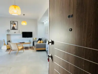 a door leading into a living room with a living room at Zonapartments B sea view- city center in Chania Town