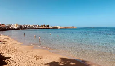 a group of people in the water at the beach at Zonapartments B sea view- city center in Chania Town