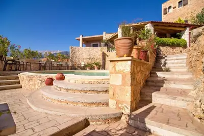 a set of stairs leading to a swimming pool at Samonas Traditional Villas Purple Villa Malotira - 85M² Maisonette in Khiliomoudhoú