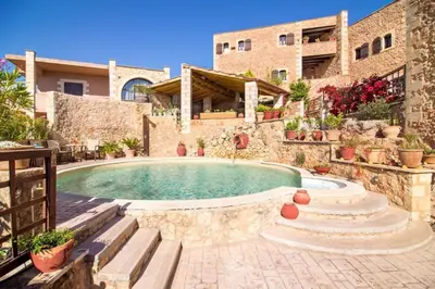 a house with a swimming pool in a yard at Traditional Crete Villa Villa Blue Mantzourana Stunning Views 1 Bedroom in Khiliomoudhoú