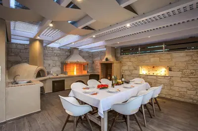 a large dining room with a white table and chairs at Luxury Villa Crete Villa Marina Mare 3 Bedroom Private Pool in Chania Town