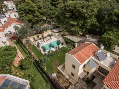 an aerial view of a house with a swimming pool at Luxury Crete Villa Villa Koukounari Private Pool Beautiful Scenery in Chania Town
