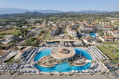 an aerial view of a resort with a pool at Caldera Beach in Plataniás