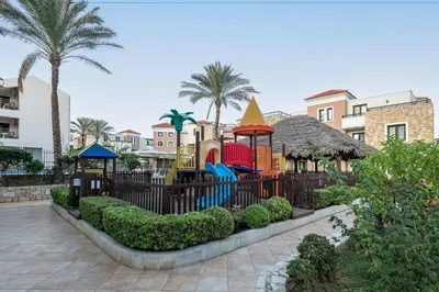 a playground at a resort with a play park at Caldera Bay in Plataniás