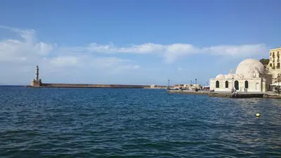 a view of a large body of water with a mosque at Stratos Villas in Melidhónion