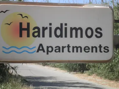a sign for a hamiltonannis applicationsagentsagents at Haridimos Apartments in Tavronitis
