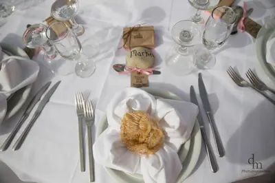 a white table with a plate of food on it at Haridimos Apartments in Tavronitis