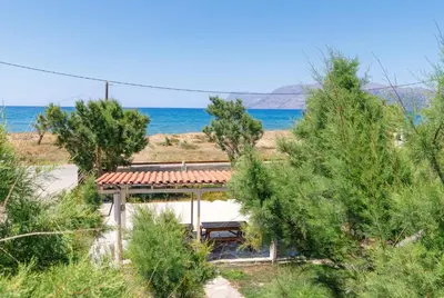 a house with a view of the ocean at Zefyros Apartments and House in Kissamos
