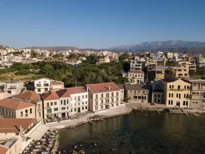 a city with buildings and a body of water at The Tanneries Hotel & Spa - a Member of Design Hotels in Chania Town