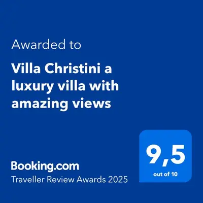 a blue screen with the text awarded to villa christin a luxury villa at Villa Christini a luxury villa with amazing views in Tzitzifés