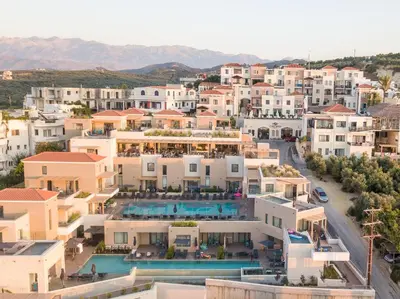 an aerial view of a city with buildings at Caldera Village in Agia Marina Nea Kydonias