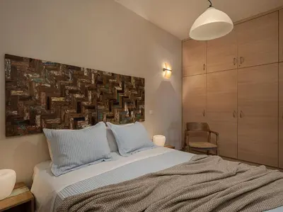 a bedroom with a bed with two pillows at Villa Hibiscus in Spiliá