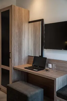 a laptop computer sitting on a desk in a room at Morum City Hotel Chania in Chania Town