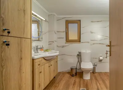 a bathroom with a toilet and a sink and a tub at Luxuryvillaschania Kore-Falasarna beach in Falasarna