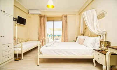 a bedroom with a bed and a window at Luxuryvillaschania Kore-Falasarna beach in Falasarna