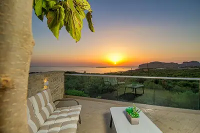 a sunset from the balcony of a villa at 2 steps Falasarna beach-Liakos- Homeleader in Falasarna