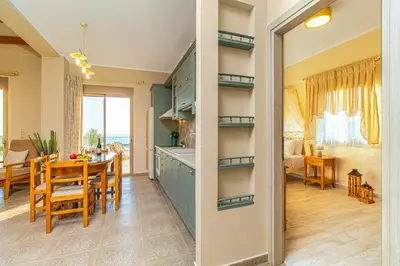 a kitchen and a dining room with a table at 2 steps Falasarna beach-Liakos- Homeleader in Falasarna