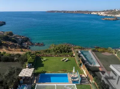 an aerial view of a house and the ocean at Villa Anemos by Estia in Kalathas