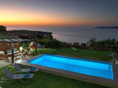 a villa with a swimming pool and a view of the ocean at Villa Anemos by Estia in Kalathas