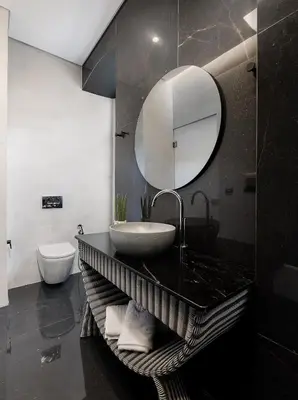 a bathroom with a sink and a mirror at Malmo Historic Hotel in Chania Town