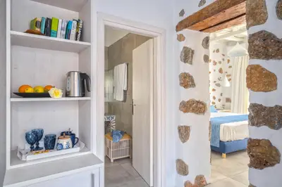 a room with a door leading to a bedroom at FantaSea Luxury Suite in Khóra Sfakíon