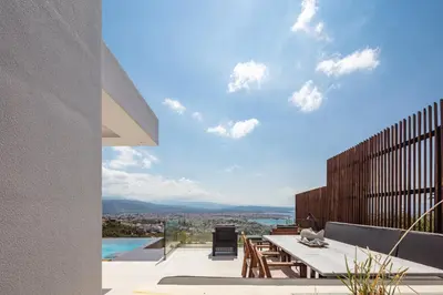 a view of the city from the balcony of a house at Regal Residence in Chania Town