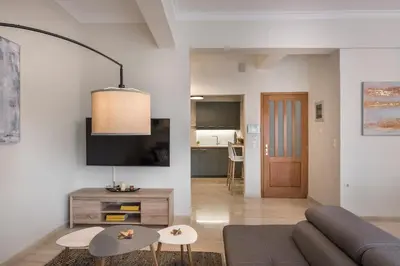a living room with a couch and a table at CALMERA Luxury Living in Chania Town