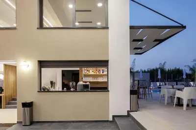 a bar on the side of a building at Sapphire Blue Suites in Kissamos