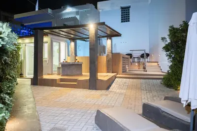 an outdoor patio with a table in a building at CAVE Luxury House in Kissamos