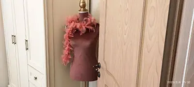 a pink wig hanging from the door of a closet at BLUE EYES VILLA in Chania Town