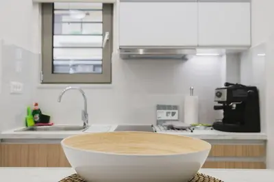 a kitchen with a bowl on top of a counter at Peris 5 with Yard steps to Bus St & Old Town in Chania Town