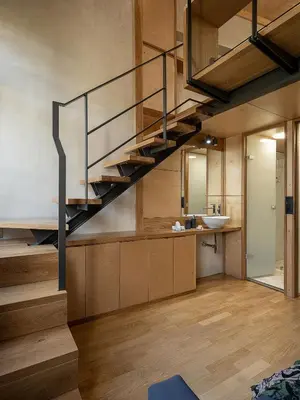 a bathroom with a staircase leading up to a sink at Casa Sorvolou in Chania Town