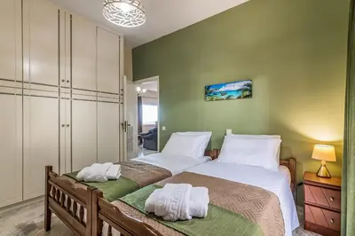 a bedroom with a large bed with towels on it at Sea Breeze & Stunning Views - Pool Dream Gem in Dhémbla