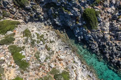 an aerial view of the ocean and rocks at Villa Aliki ,Aegean Sea Breeze 750m from the Beach! in Chania Town