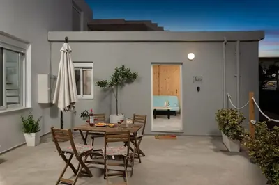 a dining room with a table and chairs and an umbrella at 