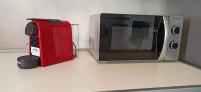 a microwave sitting on top of a kitchen counter at 
